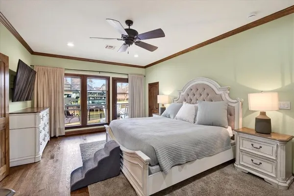 a bedroom with a large bed and a large window