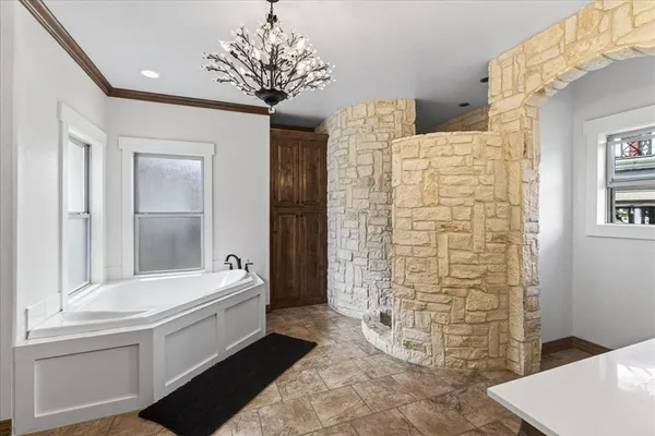 a bathroom with a sink a mirror and a bathtub