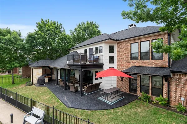 a view of a house with backyard tub and sitting area