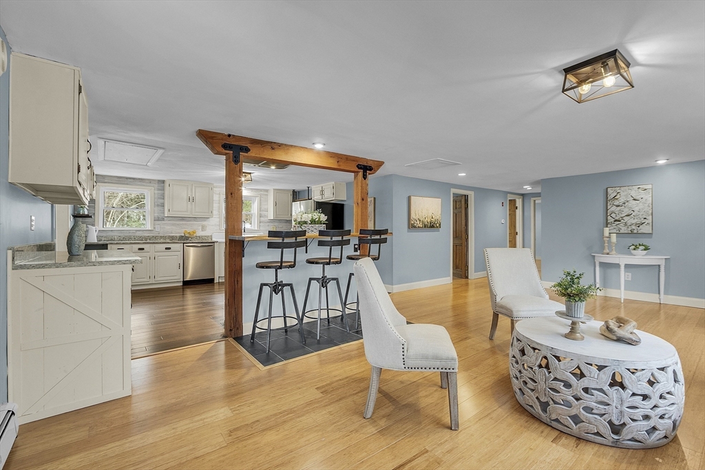 816 Patriots Road Templeton, MA 01468 - Photo 11 of 34 a living room with furniture and a wooden floor