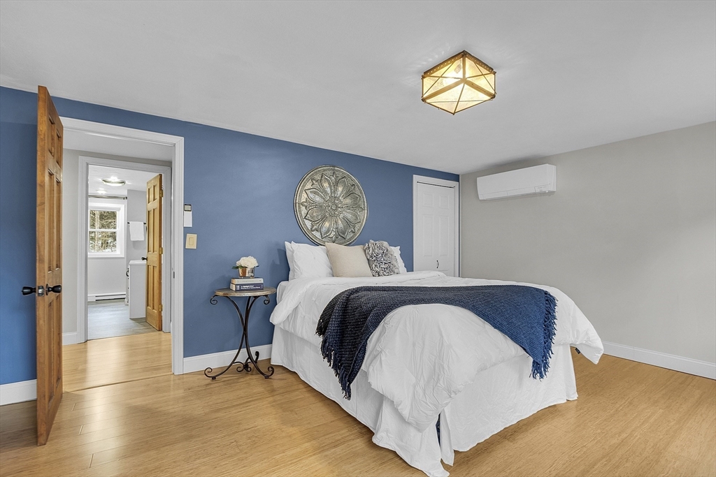 816 Patriots Road Templeton, MA 01468 - Photo 14 of 34 a bedroom with a bed and painting on the wall