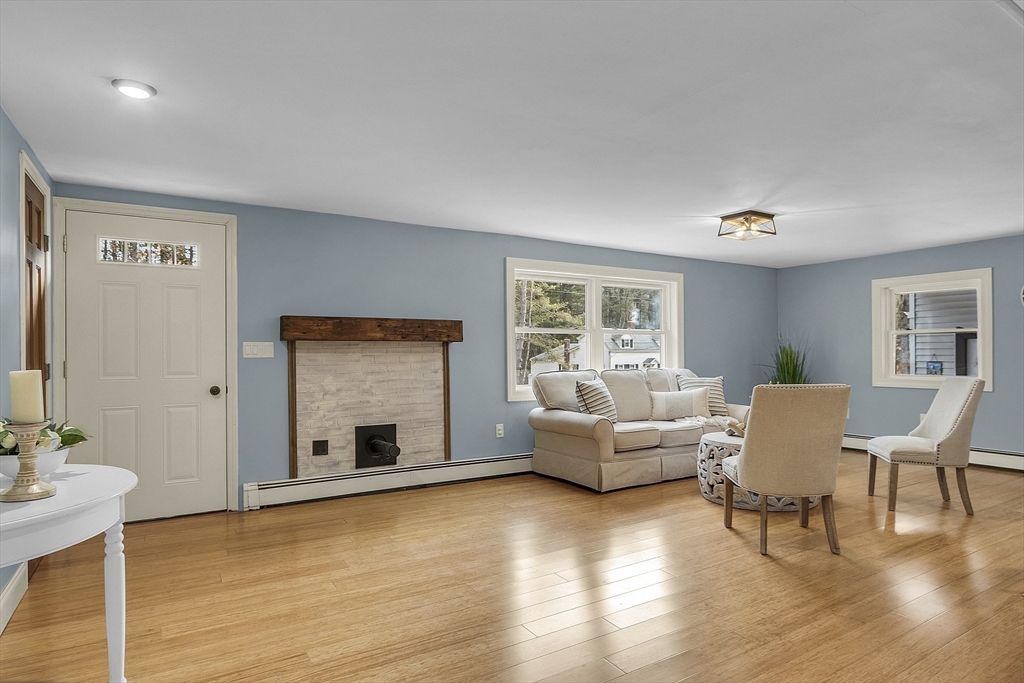 816 Patriots Road Templeton, MA 01468 - Photo 2 of 34 a living room with furniture and a fireplace