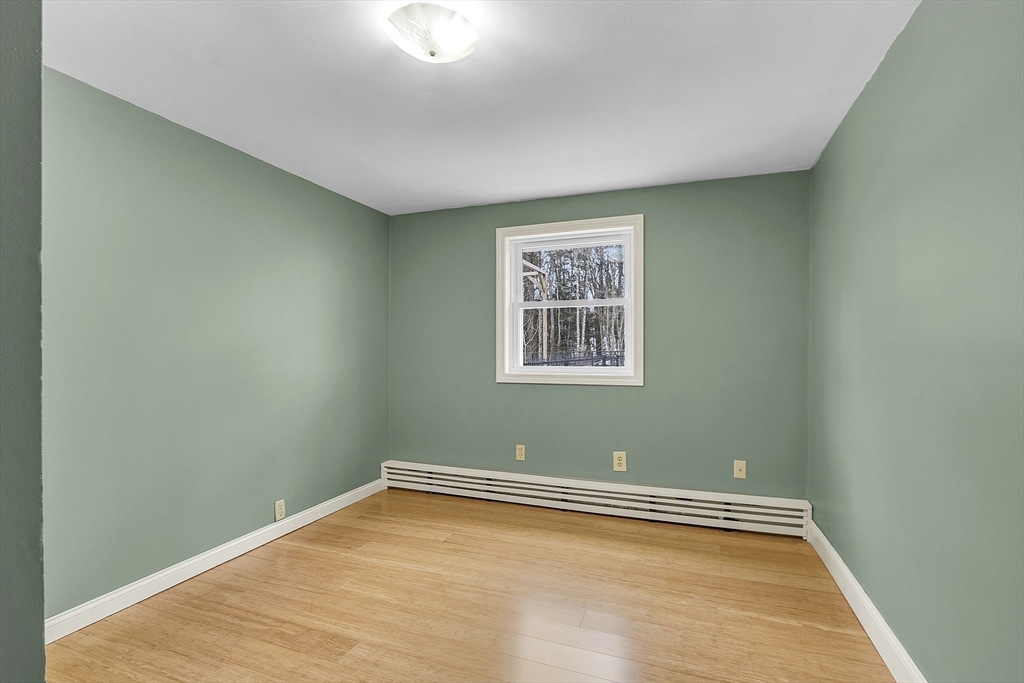 816 Patriots Road Templeton, MA 01468 - Photo 23 of 34 a view of a room with wooden floor and a window