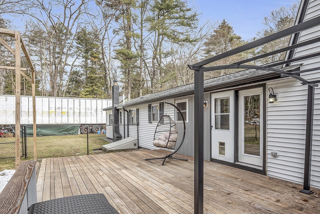 816 Patriots Road Templeton, MA 01468 - Photo 25 of 34 a view of a house with backyard and wooden deck