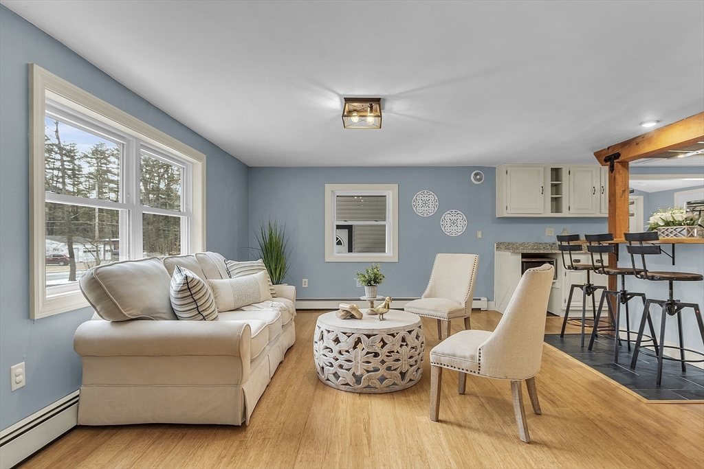 816 Patriots Road Templeton, MA 01468 - Photo 6 of 34 a living room with furniture and a large window