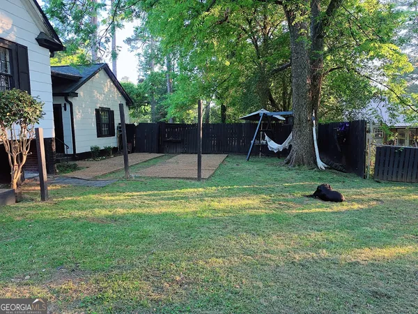 a view of a backyard with a slide and a slide