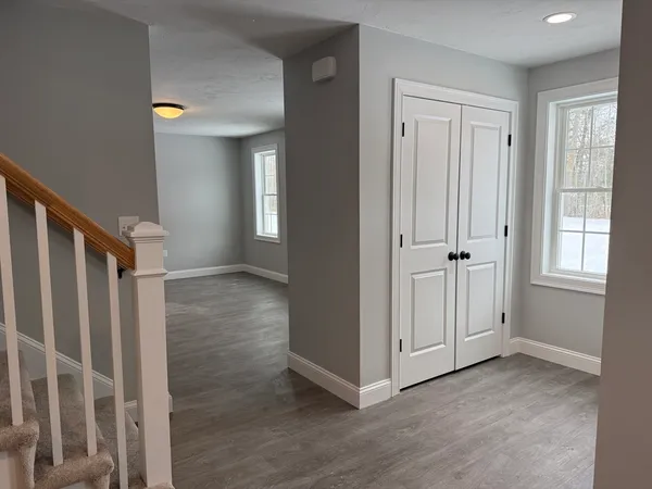 a view of entryway with wooden floor