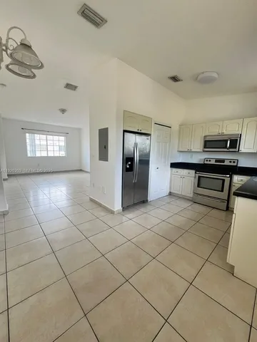 a view of a furniture and utility room in a room