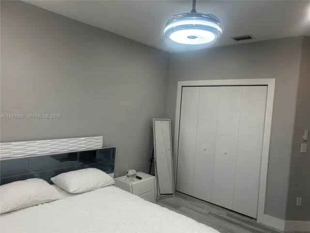 a bathroom with a table and a mirror