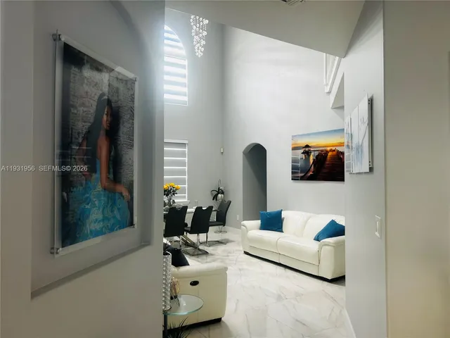 a living room with furniture and a window