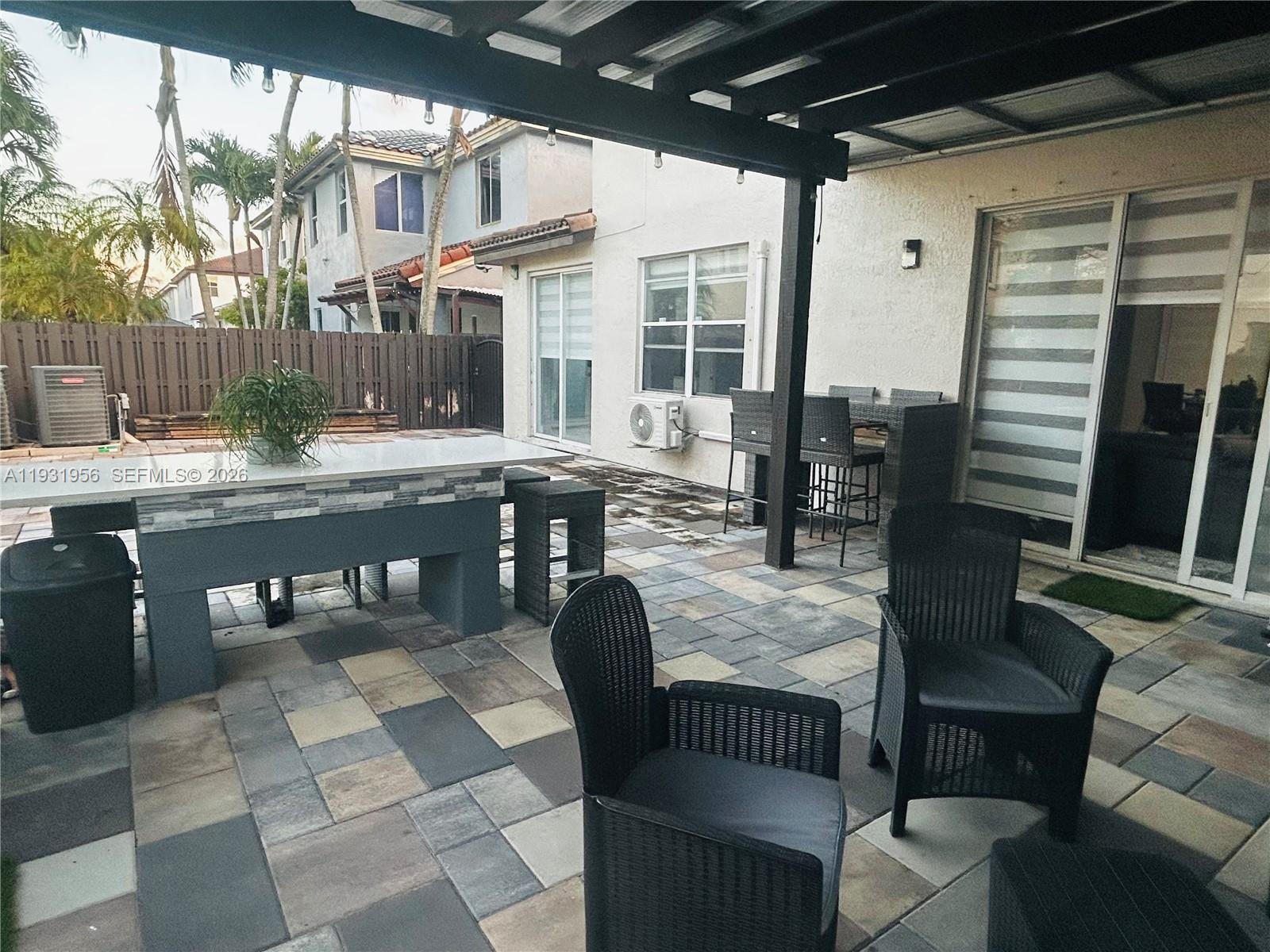 13995 Southwest 154th Street Miami, FL 33177 - Photo 27 of 27 a outdoor dining space with furniture