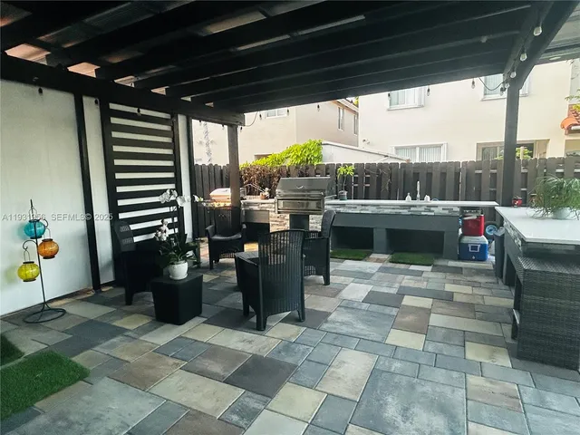 a outdoor dining space with furniture