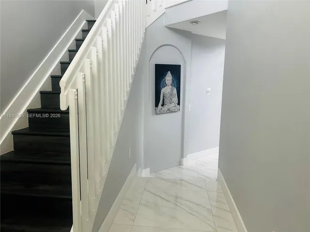 a view of an entryway with hallway