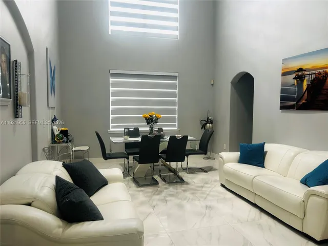 a living room with furniture and a window