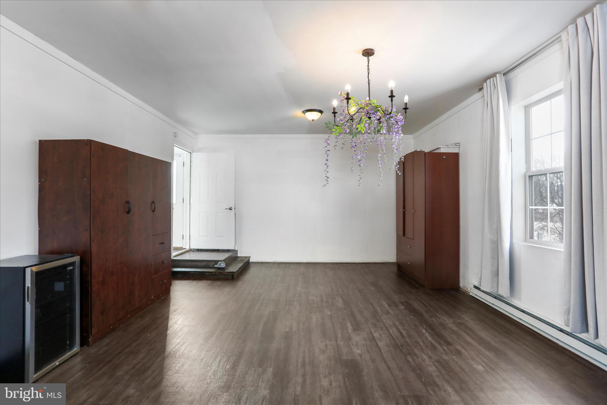 2828 Falling Spring Road Chambersburg, PA 17202 - Photo 14 of 26 a view of a room with wooden floor and windows
