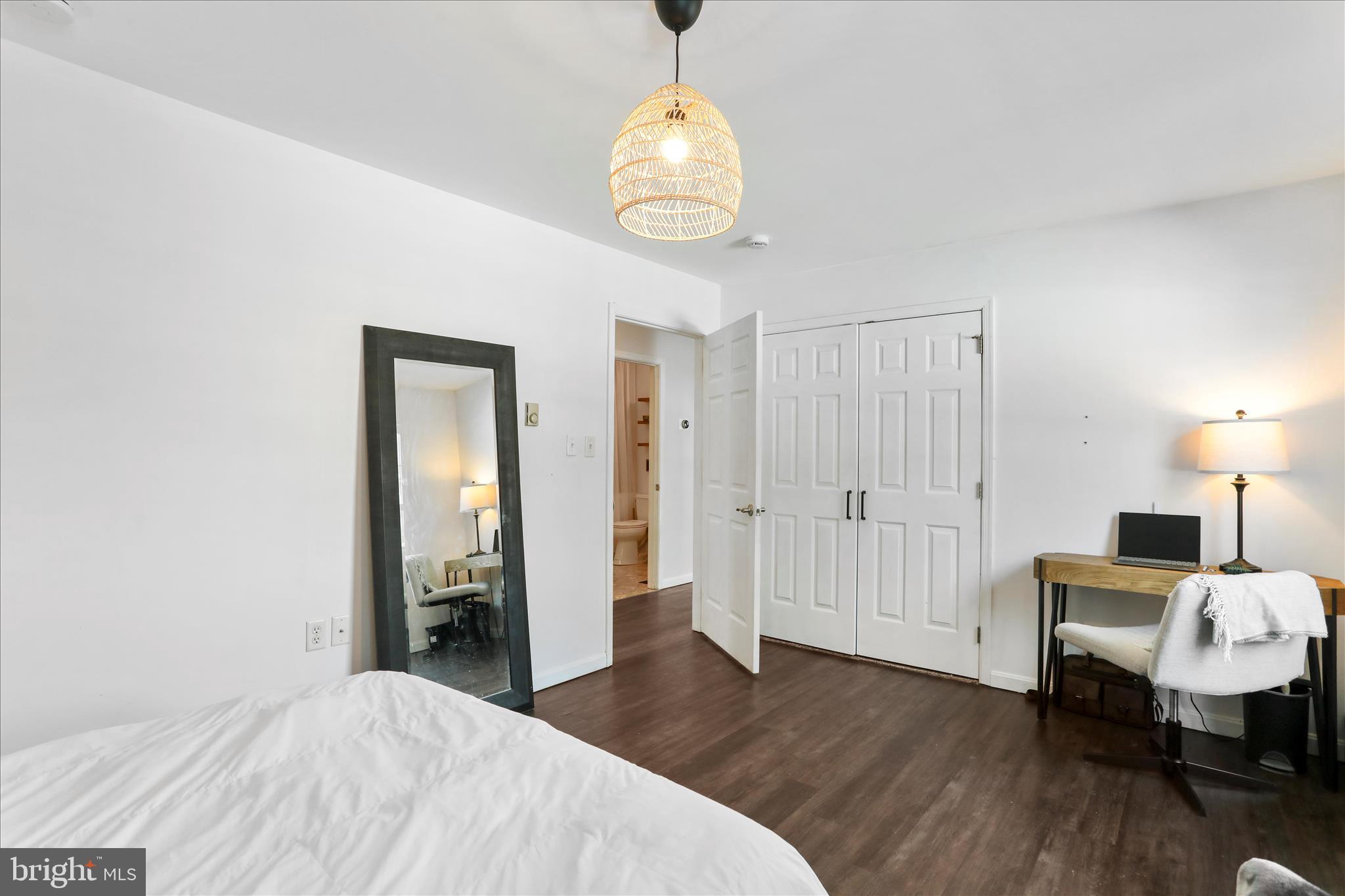 2828 Falling Spring Road Chambersburg, PA 17202 - Photo 17 of 26 a bedroom with a bed and a chandelier