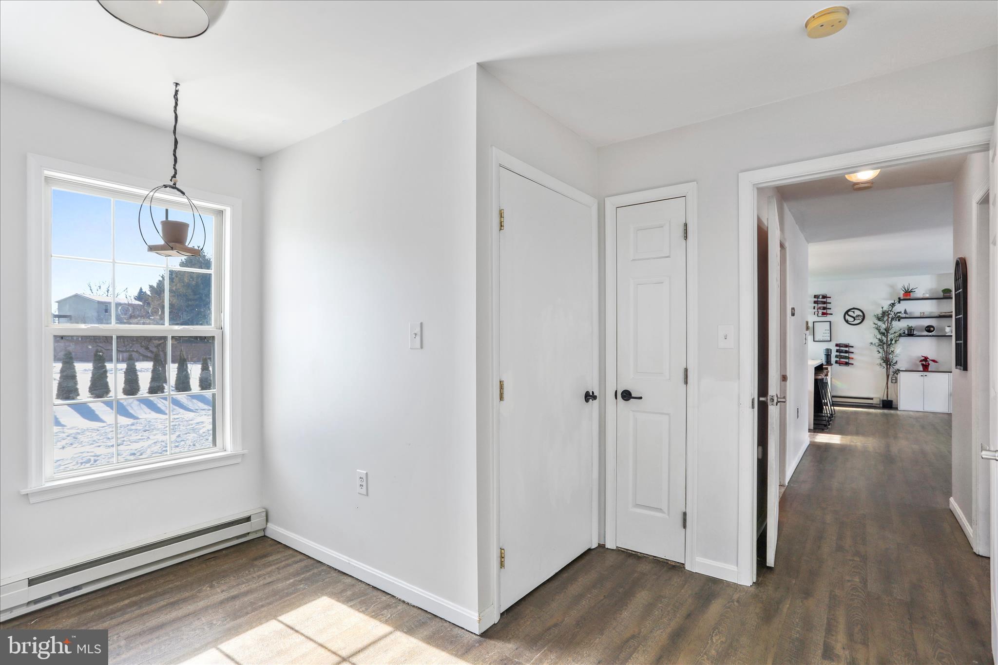 2828 Falling Spring Road Chambersburg, PA 17202 - Photo 20 of 26 a view of a hallway with wooden floor and cabinet