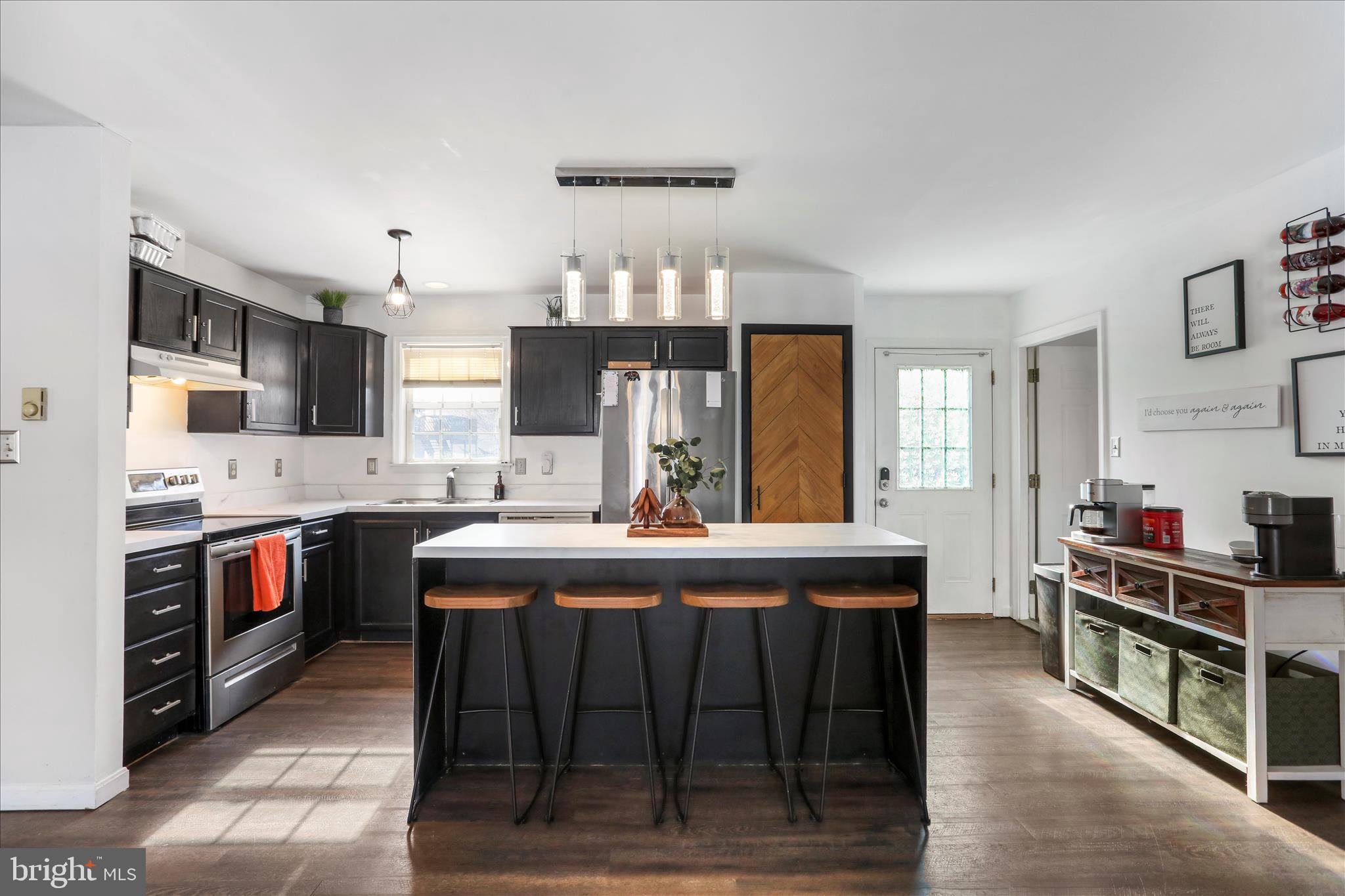 2828 Falling Spring Road Chambersburg, PA 17202 - Photo 8 of 26 a large kitchen with a stove and cabinets