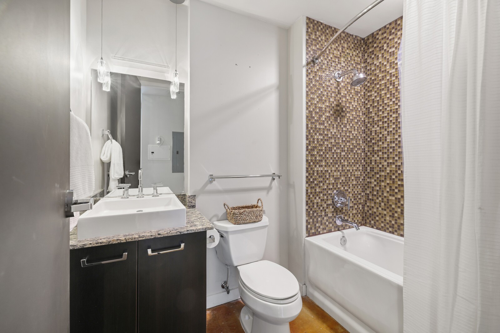 600 12th Avenue South, Unit 910 Nashville, TN 37203 - Photo 7 of 15 a bathroom with a sink a toilet and shower