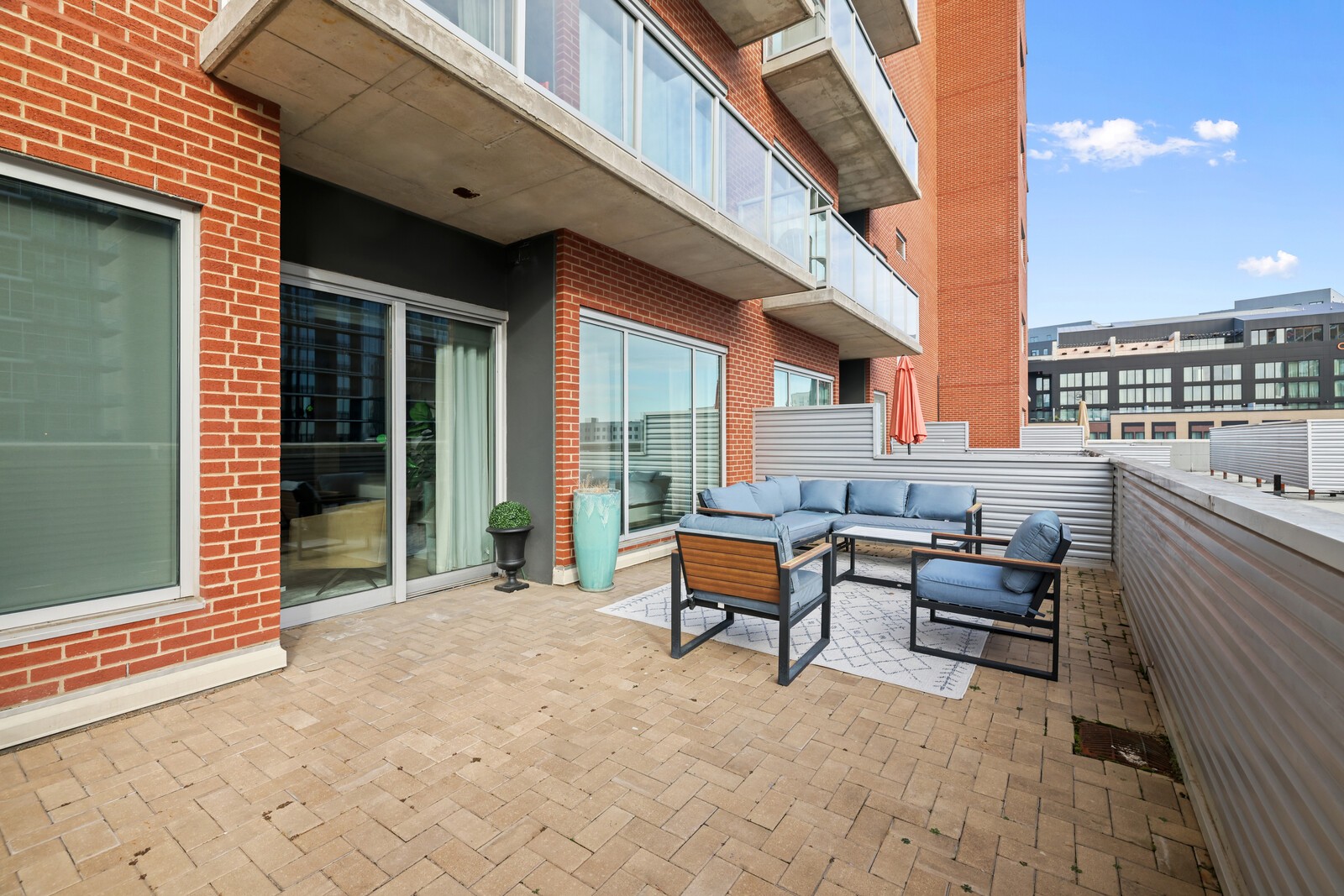 600 12th Avenue South, Unit 910 Nashville, TN 37203 - Photo 9 of 15 a building outdoor space with patio furniture