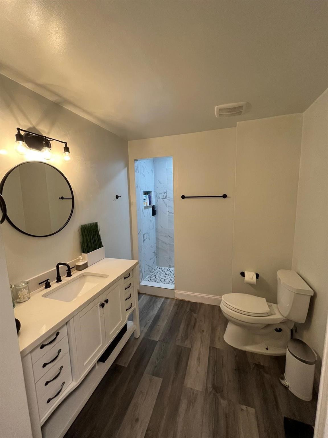 20780 Boca Ridge Drive North, Unit 20780 Boca Raton, FL 33428 - Photo 11 of 35 a bathroom with a double vanity sink mirror and toilet