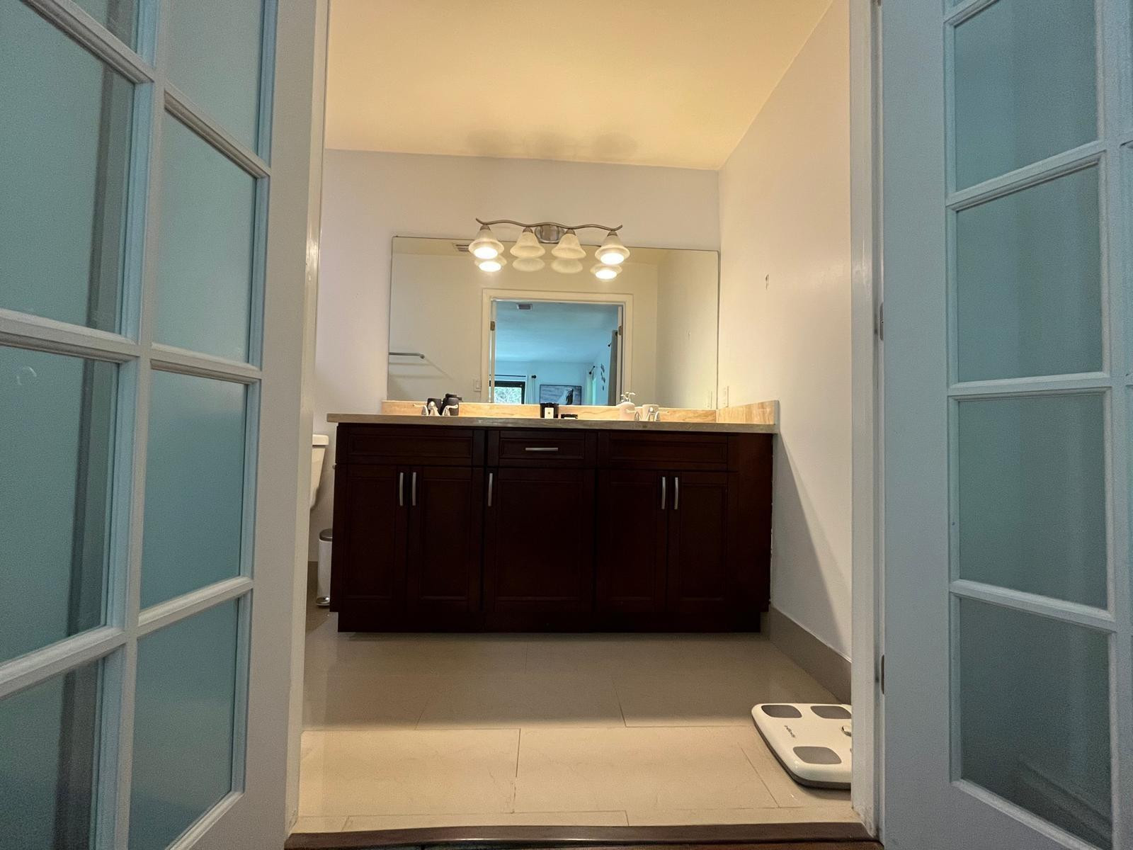 20780 Boca Ridge Drive North, Unit 20780 Boca Raton, FL 33428 - Photo 19 of 35 a bathroom with a sink and a mirror