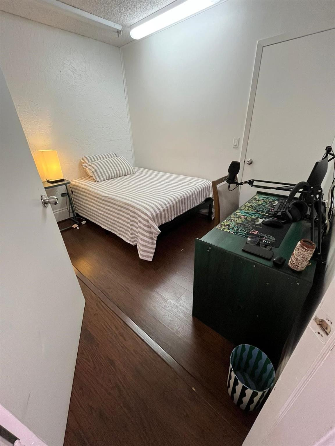 20780 Boca Ridge Drive North, Unit 20780 Boca Raton, FL 33428 - Photo 20 of 35 a bedroom with furniture and a wooden floor