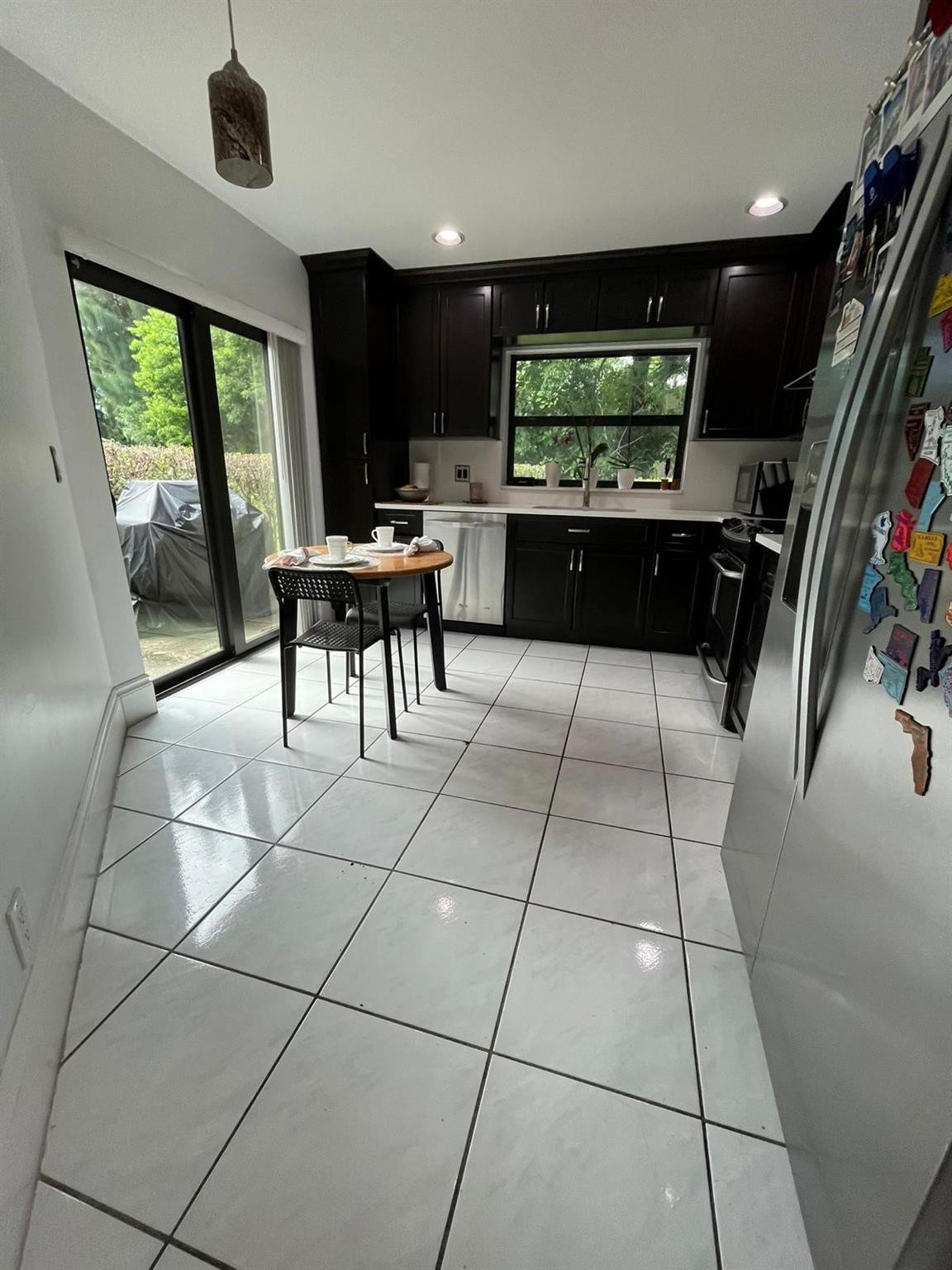 20780 Boca Ridge Drive North, Unit 20780 Boca Raton, FL 33428 - Photo 24 of 35 a living room with furniture and a flat screen tv