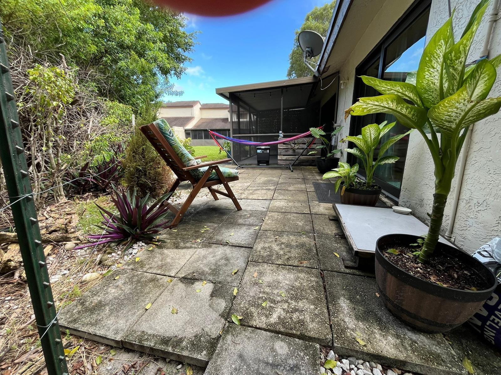 20780 Boca Ridge Drive North, Unit 20780 Boca Raton, FL 33428 - Photo 28 of 35 a view of a porch with furniture and a potted plant