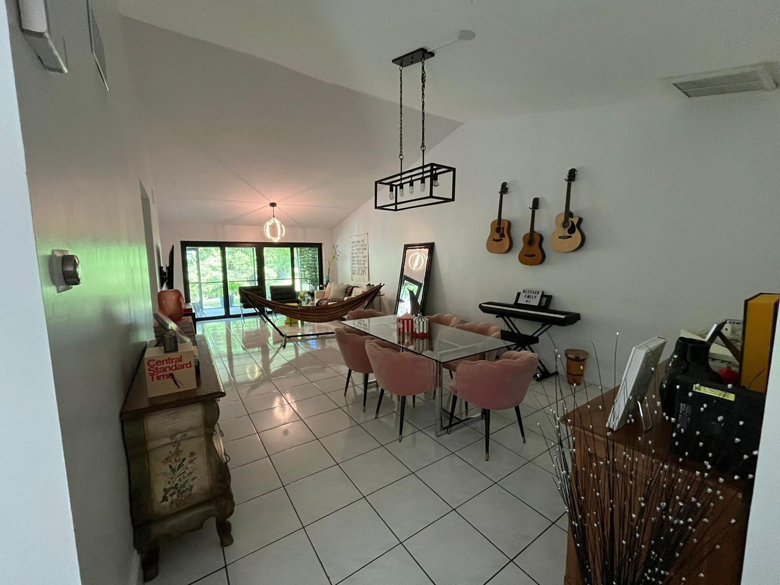 20780 Boca Ridge Drive North, Unit 20780 Boca Raton, FL 33428 - Photo 6 of 35 a living room with furniture a rug and gym equipment