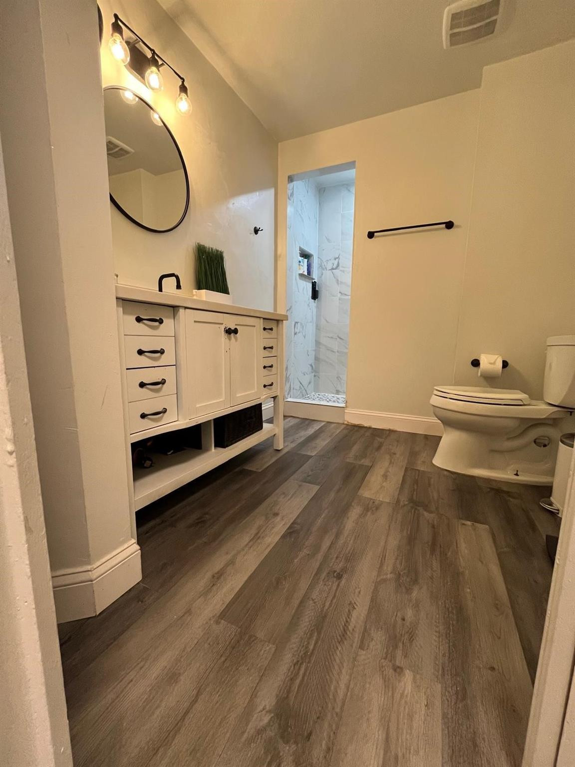 20780 Boca Ridge Drive North, Unit 20780 Boca Raton, FL 33428 - Photo 10 of 35 a bathroom with a sink mirror and a toilet
