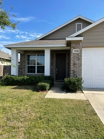 a front view of a house having yard