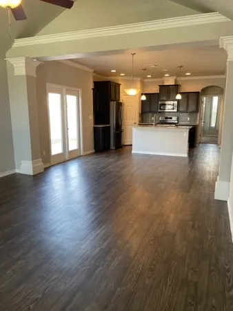 a view of a living room with a kitchen