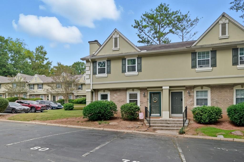 6900 Roswell Road, Unit G1 Atlanta, GA 30328 - Photo 1 of 1 a front view of a house with a garden and plants