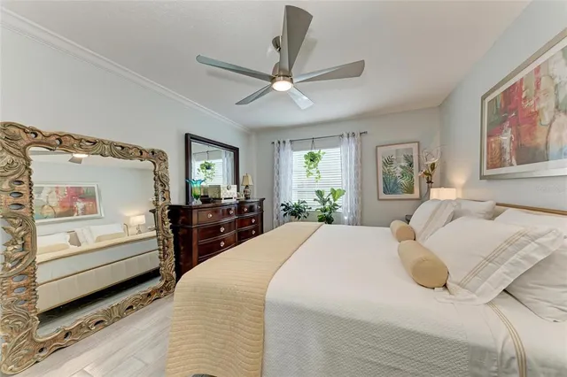a living room with furniture and a book shelf
