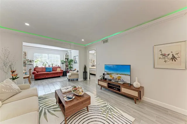 a living room with furniture and a rug