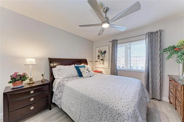 a dining room with lots of tables a chairs and a chandelier