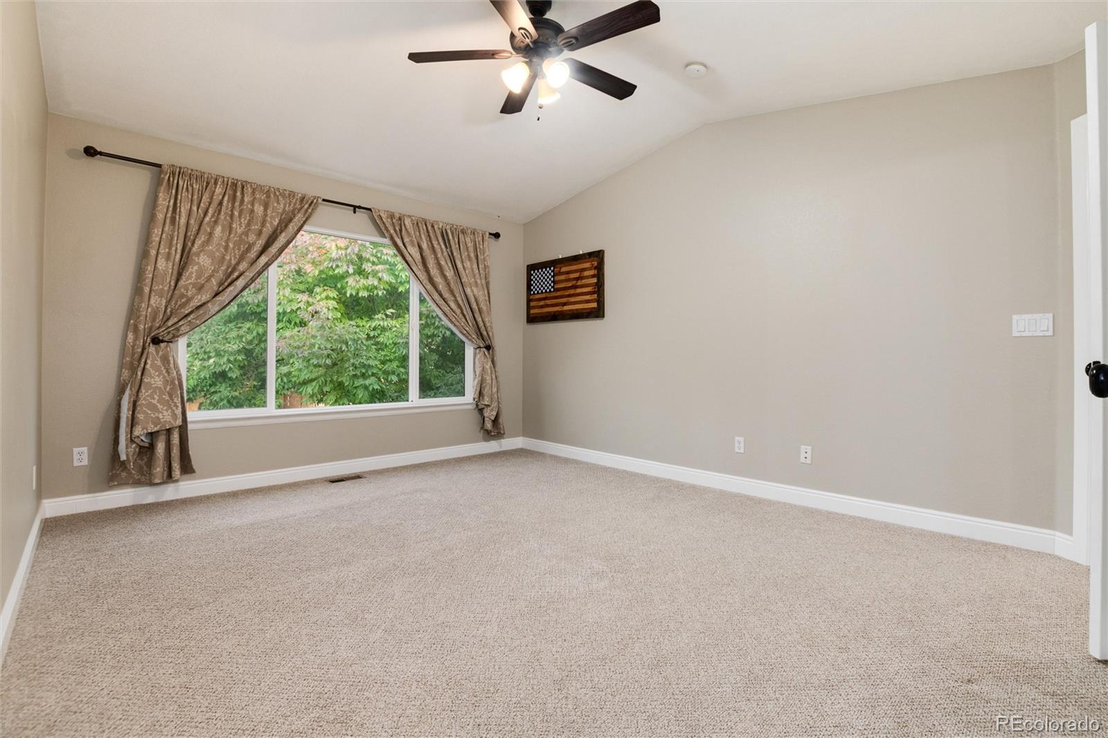 9218 Fox Fire Lane Highlands Ranch, CO 80129 - Photo 22 of 38 a view of an empty room with a window