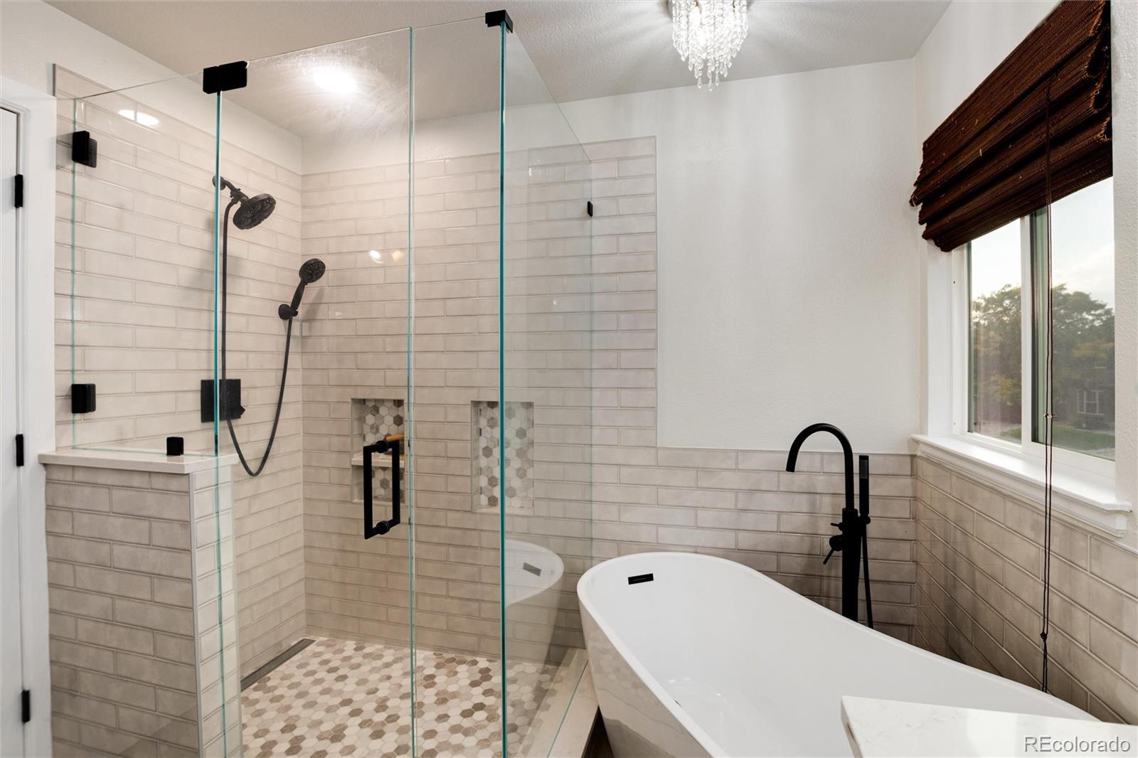 9218 Fox Fire Lane Highlands Ranch, CO 80129 - Photo 25 of 38 a bathroom with a sink a toilet and shower