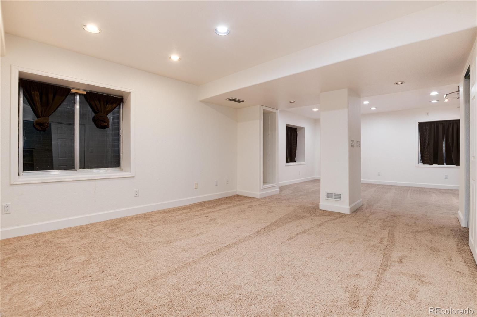 9218 Fox Fire Lane Highlands Ranch, CO 80129 - Photo 31 of 38 a view of an empty room with a window