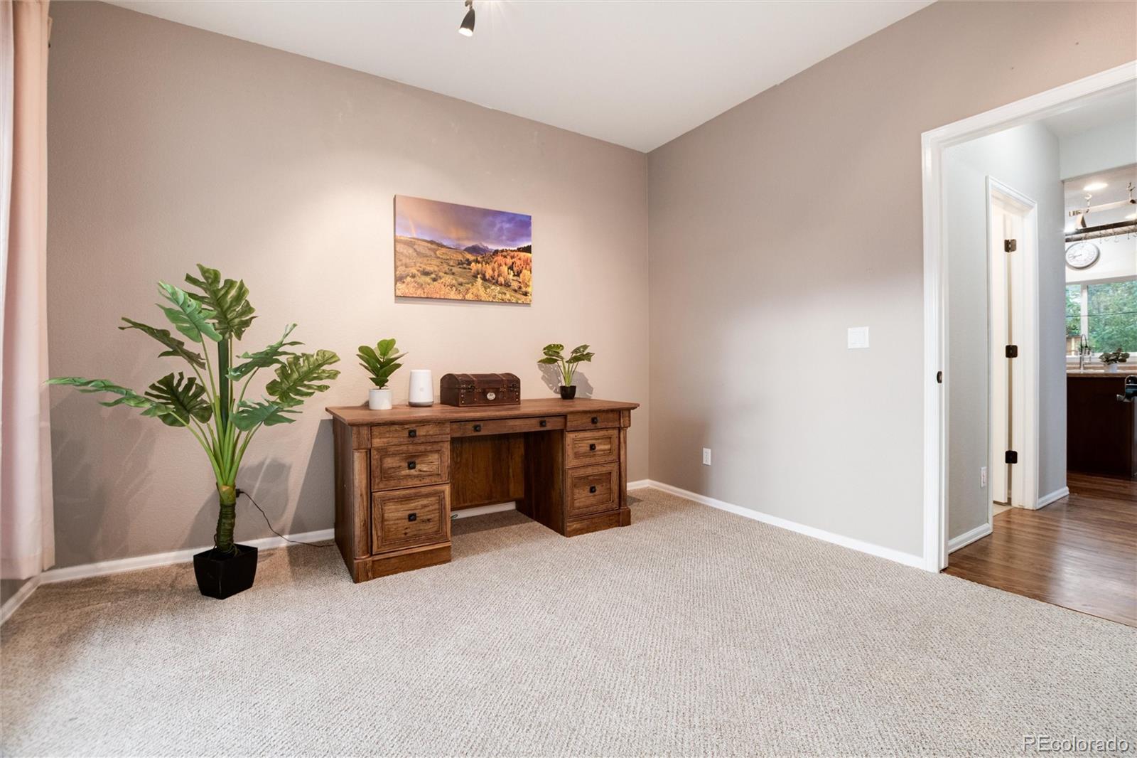 9218 Fox Fire Lane Highlands Ranch, CO 80129 - Photo 7 of 38 a view of workspace with furniture and potted plant
