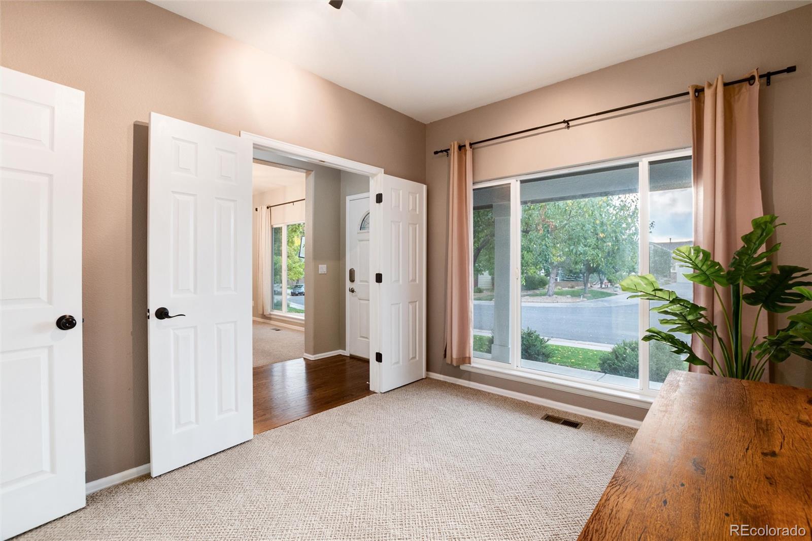 9218 Fox Fire Lane Highlands Ranch, CO 80129 - Photo 8 of 38 a view of livingroom with furniture and window