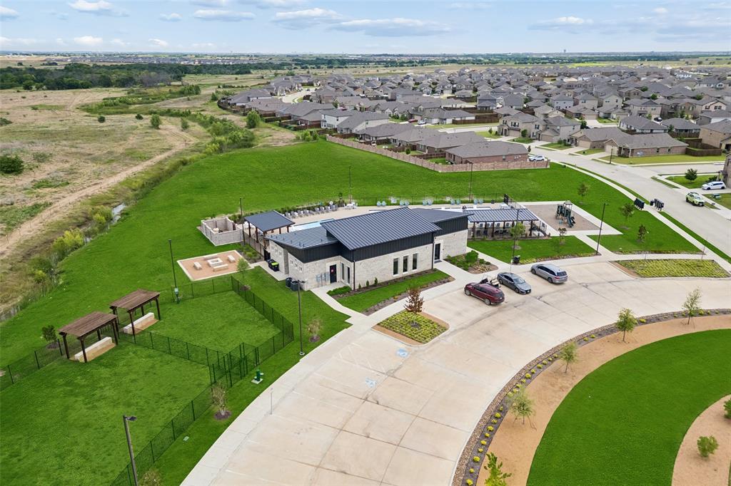 14163 Kempt Drive Pilot Point, TX 76258 - Photo 24 of 29 Mobberly Farms is known for its impressive amenities and welcoming community atmosphere. Residents enjoy a beautifully appointed clubhouse, resort-style pool, outdoor recreation areas, walking paths, and expansive green spaces, creating countless opportunities to relax, stay active, and connect with neighbors.