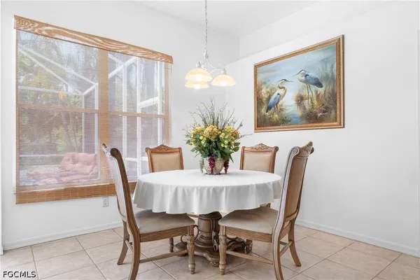 a dining room with furniture and window
