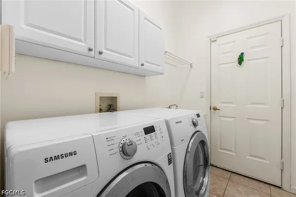a kitchen with stainless steel appliances a refrigerator and a table