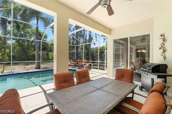 a view of a dining room with furniture window and outside view