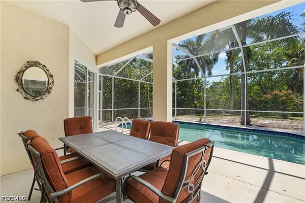 a view of a swimming pool with a patio
