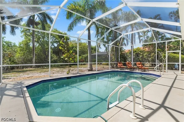 a view of outdoor space with swimming pool and sitting space