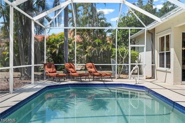 a view of a swimming pool with a lounge chair