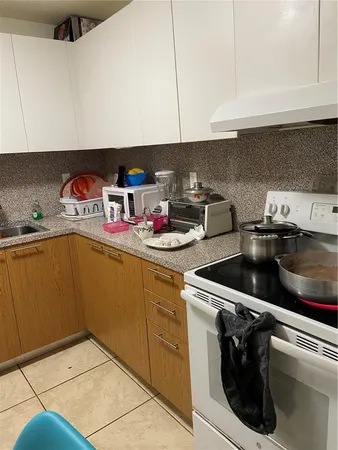 a utility room with sink dryer and washer